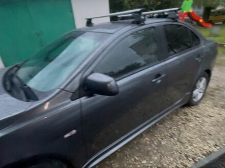 Серый Мицубиси Лансер, объемом двигателя 2 л и пробегом 131 тыс. км за 4200 $, фото 1 на Automoto.ua