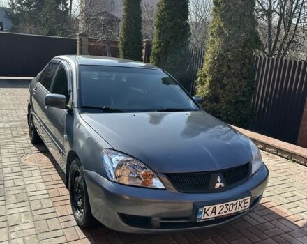 Серый Мицубиси Лансер, объемом двигателя 1.6 л и пробегом 100 тыс. км за 4450 $, фото 1 на Automoto.ua