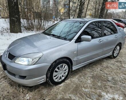 Серый Мицубиси Лансер, объемом двигателя 1.6 л и пробегом 255 тыс. км за 3800 $, фото 1 на Automoto.ua