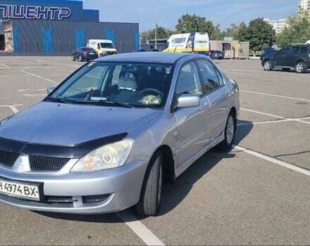 Сірий Міцубісі Lancer, об'ємом двигуна 1.6 л та пробігом 257 тис. км за 4500 $, фото 1 на Automoto.ua