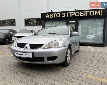 Серый Мицубиси Лансер, объемом двигателя 1.6 л и пробегом 206 тыс. км за 4799 $, фото 1 на Automoto.ua