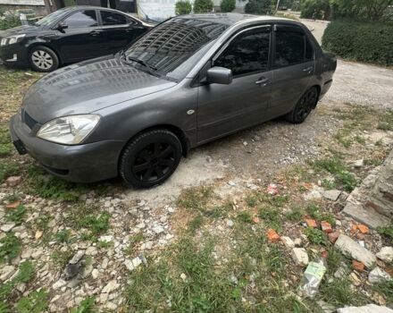 Серый Мицубиси Лансер, объемом двигателя 1.6 л и пробегом 263 тыс. км за 4999 $, фото 1 на Automoto.ua