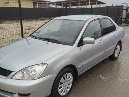 Серый Мицубиси Лансер, объемом двигателя 1.6 л и пробегом 225 тыс. км за 3100 $, фото 1 на Automoto.ua