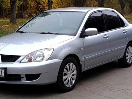 Серый Мицубиси Лансер, объемом двигателя 1.58 л и пробегом 176 тыс. км за 5000 $, фото 1 на Automoto.ua