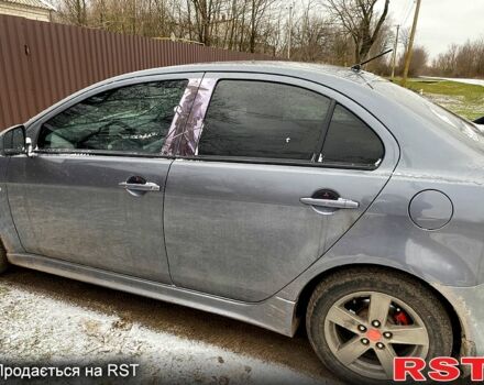 Серый Мицубиси Лансер, объемом двигателя 2 л и пробегом 190 тыс. км за 5600 $, фото 1 на Automoto.ua