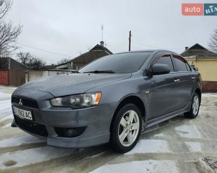 Серый Мицубиси Лансер, объемом двигателя 2 л и пробегом 185 тыс. км за 6999 $, фото 1 на Automoto.ua