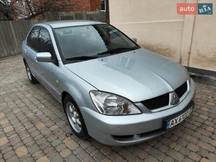Серый Мицубиси Лансер, объемом двигателя 1.58 л и пробегом 185 тыс. км за 4700 $, фото 1 на Automoto.ua