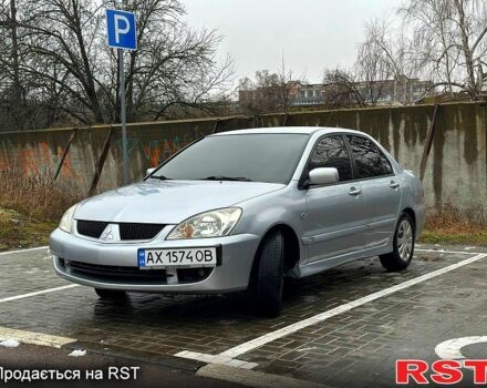 Серый Мицубиси Лансер, объемом двигателя 1.6 л и пробегом 165 тыс. км за 4000 $, фото 1 на Automoto.ua