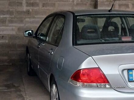 Сірий Міцубісі Lancer, об'ємом двигуна 1.58 л та пробігом 89 тис. км за 7500 $, фото 1 на Automoto.ua