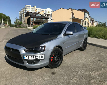 Серый Мицубиси Лансер, объемом двигателя 2 л и пробегом 256 тыс. км за 7000 $, фото 1 на Automoto.ua