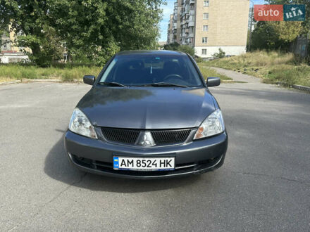 Сірий Міцубісі Lancer, об'ємом двигуна 1.58 л та пробігом 190 тис. км за 4300 $, фото 1 на Automoto.ua