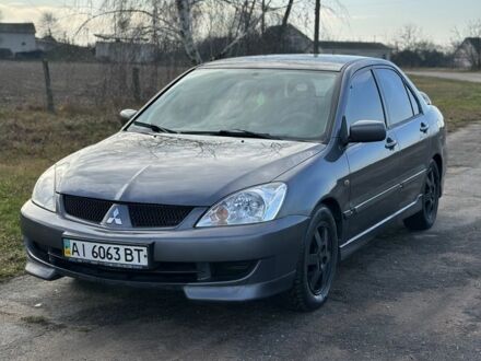 Серый Мицубиси Лансер, объемом двигателя 1.6 л и пробегом 114 тыс. км за 4000 $, фото 1 на Automoto.ua