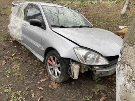 Серый Мицубиси Лансер, объемом двигателя 1.6 л и пробегом 280 тыс. км за 900 $, фото 1 на Automoto.ua