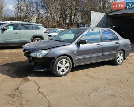 Серый Мицубиси Лансер, объемом двигателя 1.58 л и пробегом 200 тыс. км за 1799 $, фото 1 на Automoto.ua