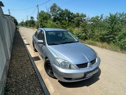 Сірий Міцубісі Lancer, об'ємом двигуна 1.58 л та пробігом 225 тис. км за 3700 $, фото 1 на Automoto.ua