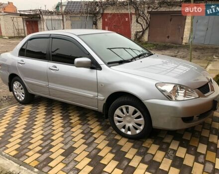 Серый Мицубиси Лансер, объемом двигателя 1.58 л и пробегом 132 тыс. км за 5500 $, фото 1 на Automoto.ua