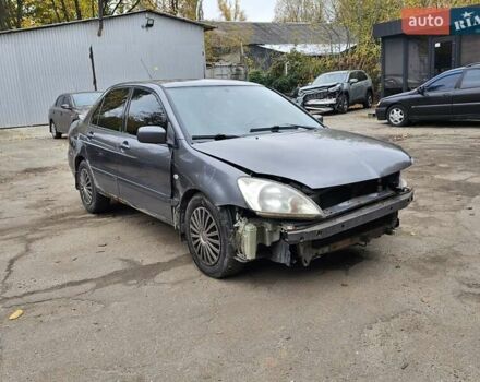 Сірий Міцубісі Lancer, об'ємом двигуна 1.58 л та пробігом 200 тис. км за 1700 $, фото 1 на Automoto.ua