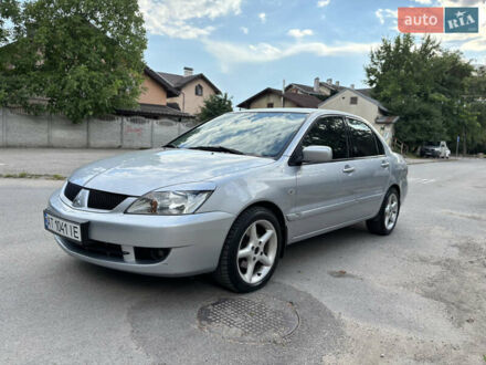 Сірий Міцубісі Lancer, об'ємом двигуна 1.58 л та пробігом 252 тис. км за 4800 $, фото 1 на Automoto.ua