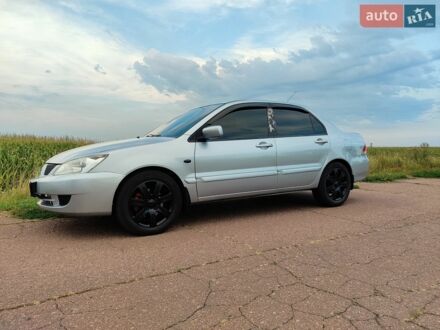 Сірий Міцубісі Lancer, об'ємом двигуна 1.58 л та пробігом 274 тис. км за 3950 $, фото 1 на Automoto.ua