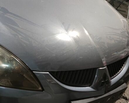 Серый Мицубиси Лансер, объемом двигателя 1 л и пробегом 126 тыс. км за 5500 $, фото 1 на Automoto.ua