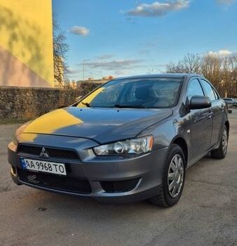 Серый Мицубиси Лансер, объемом двигателя 1.5 л и пробегом 248 тыс. км за 6000 $, фото 1 на Automoto.ua