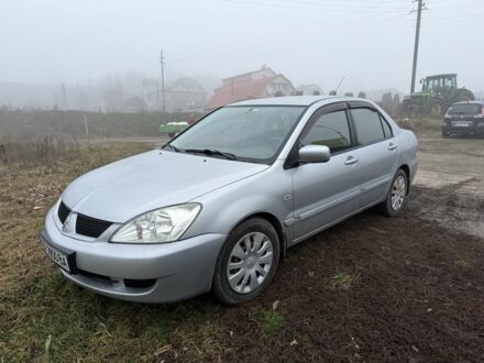 Серый Мицубиси Лансер, объемом двигателя 1.6 л и пробегом 230 тыс. км за 3400 $, фото 1 на Automoto.ua