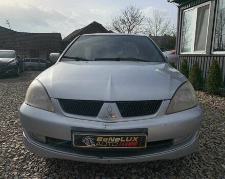 Серый Мицубиси Лансер, объемом двигателя 1.6 л и пробегом 227 тыс. км за 3599 $, фото 1 на Automoto.ua