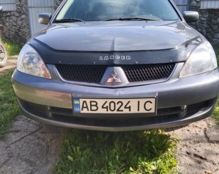 Серый Мицубиси Лансер, объемом двигателя 1.6 л и пробегом 143 тыс. км за 5650 $, фото 1 на Automoto.ua