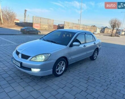 Серый Мицубиси Лансер, объемом двигателя 1.6 л и пробегом 228 тыс. км за 2999 $, фото 1 на Automoto.ua