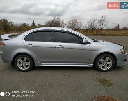 Серый Мицубиси Лансер, объемом двигателя 2 л и пробегом 231 тыс. км за 8000 $, фото 1 на Automoto.ua