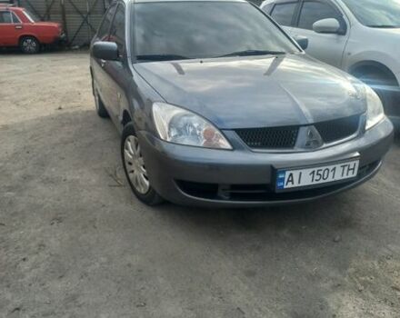 Серый Мицубиси Лансер, объемом двигателя 1.58 л и пробегом 102 тыс. км за 5399 $, фото 1 на Automoto.ua