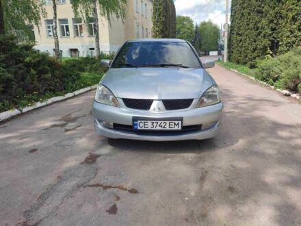 Сірий Міцубісі Lancer, об'ємом двигуна 1.6 л та пробігом 180 тис. км за 5400 $, фото 1 на Automoto.ua