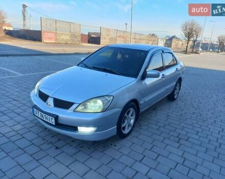 Серый Мицубиси Лансер, объемом двигателя 1.58 л и пробегом 228 тыс. км за 3600 $, фото 1 на Automoto.ua