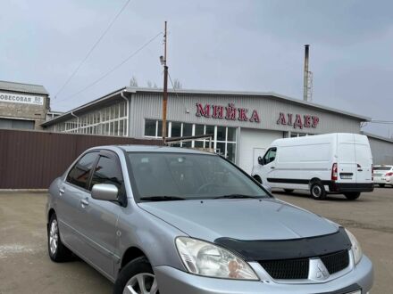 Серый Мицубиси Лансер, объемом двигателя 1.6 л и пробегом 206 тыс. км за 3800 $, фото 1 на Automoto.ua