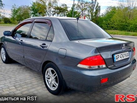 Мицубиси Лансер 2009 в Запорожье на Automoto.ua Серый Мицубиси Лансер, объемом двигателя 1.6 л и пробегом 200 тыс. км за 5900 $, фото 1 на Automoto.ua