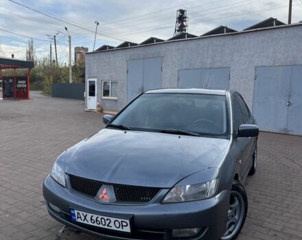 Серый Мицубиси Лансер, объемом двигателя 1.6 л и пробегом 318 тыс. км за 3800 $, фото 1 на Automoto.ua
