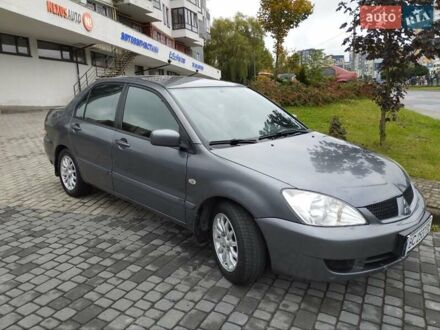Сірий Міцубісі Lancer, об'ємом двигуна 1.58 л та пробігом 209 тис. км за 2900 $, фото 1 на Automoto.ua