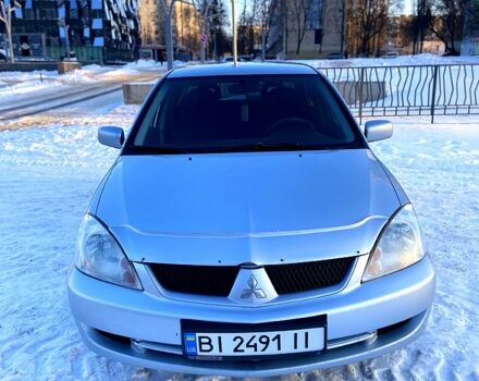 Серый Мицубиси Лансер, объемом двигателя 1.6 л и пробегом 24300 тыс. км за 4999 $, фото 1 на Automoto.ua