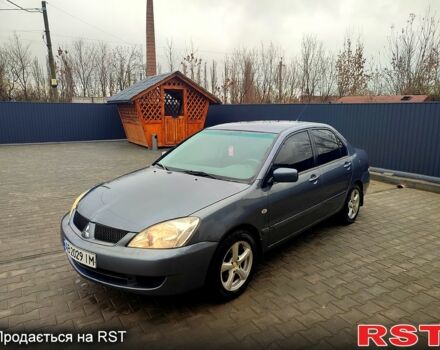 Сірий Міцубісі Lancer, об'ємом двигуна 1.6 л та пробігом 197 тис. км за 3600 $, фото 1 на Automoto.ua