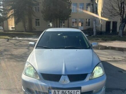 Серый Мицубиси Лансер, объемом двигателя 1.58 л и пробегом 236 тыс. км за 3350 $, фото 1 на Automoto.ua
