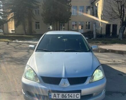 Серый Мицубиси Лансер, объемом двигателя 1.58 л и пробегом 236 тыс. км за 3350 $, фото 1 на Automoto.ua