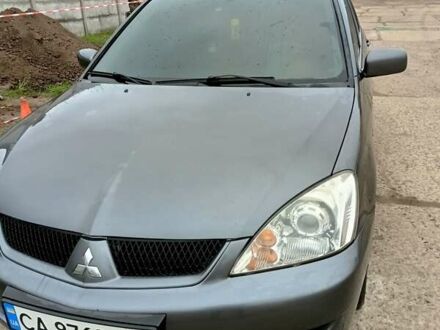 Серый Мицубиси Лансер, объемом двигателя 1.58 л и пробегом 159 тыс. км за 6000 $, фото 1 на Automoto.ua