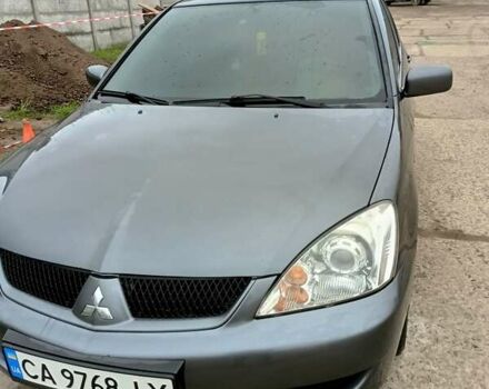 Сірий Міцубісі Lancer, об'ємом двигуна 1.58 л та пробігом 159 тис. км за 6000 $, фото 1 на Automoto.ua