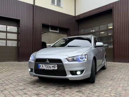 Серый Мицубиси Лансер, объемом двигателя 2 л и пробегом 220 тыс. км за 7450 $, фото 1 на Automoto.ua