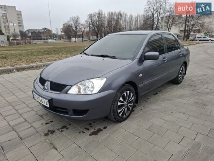 Серый Мицубиси Лансер, объемом двигателя 1.6 л и пробегом 160 тыс. км за 4999 $, фото 1 на Automoto.ua