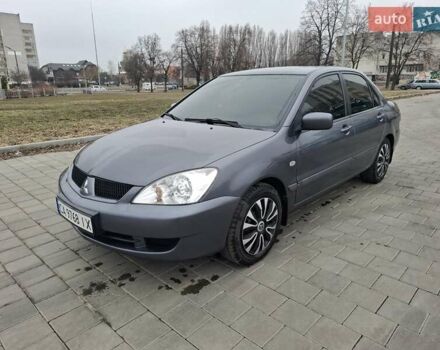 Серый Мицубиси Лансер, объемом двигателя 1.6 л и пробегом 160 тыс. км за 4999 $, фото 1 на Automoto.ua