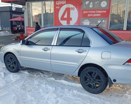 Серый Мицубиси Лансер, объемом двигателя 1.6 л и пробегом 312 тыс. км за 5500 $, фото 1 на Automoto.ua