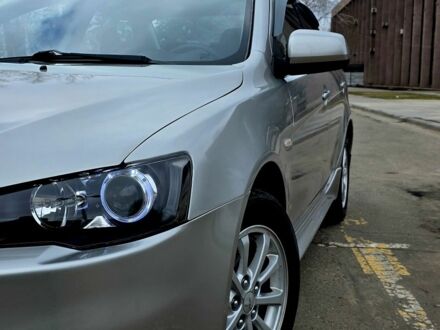 Серый Мицубиси Лансер, объемом двигателя 1.6 л и пробегом 79 тыс. км за 8500 $, фото 1 на Automoto.ua