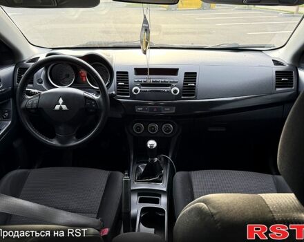 Синій Міцубісі Lancer, об'ємом двигуна 1.8 л та пробігом 222 тис. км за 4750 $, фото 5 на Automoto.ua