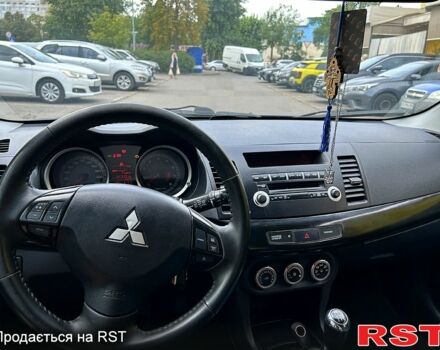 Синій Міцубісі Lancer, об'ємом двигуна 1.8 л та пробігом 221 тис. км за 6900 $, фото 4 на Automoto.ua